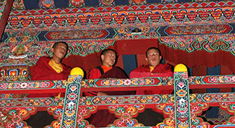 monks and red painted balconies - Cultural Tours